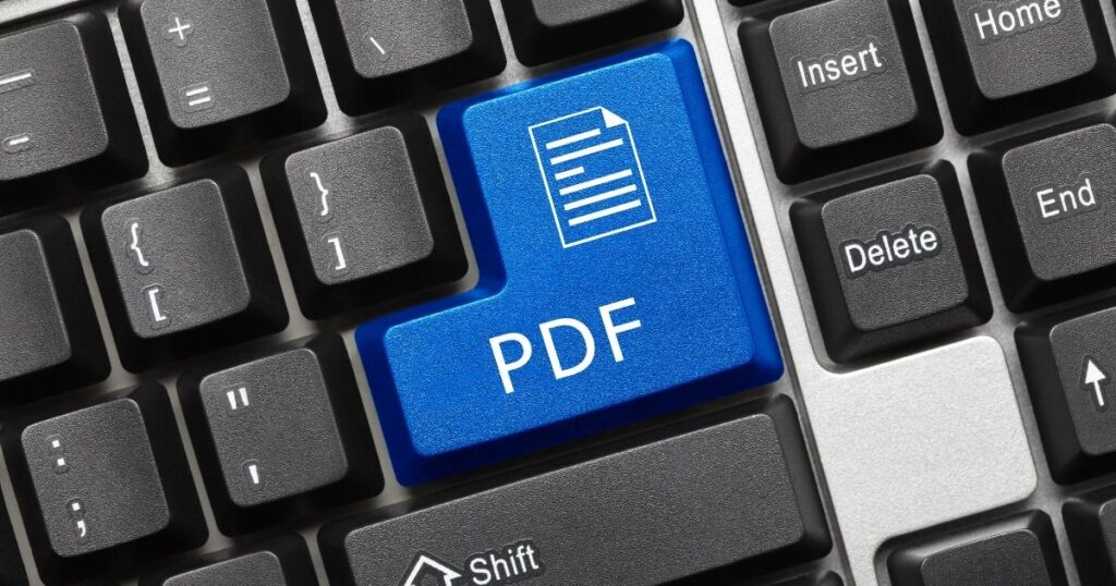 Tasto PDF blu su una tastiera di computer, a simboleggiare il formato PDF