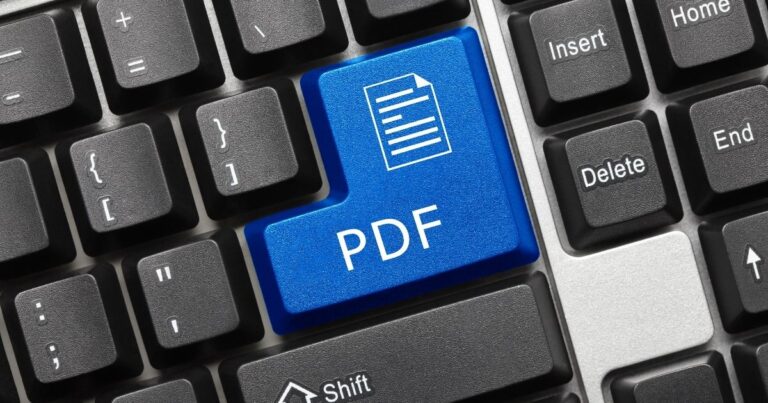 Tasto PDF blu su una tastiera di computer, a simboleggiare il formato PDF
